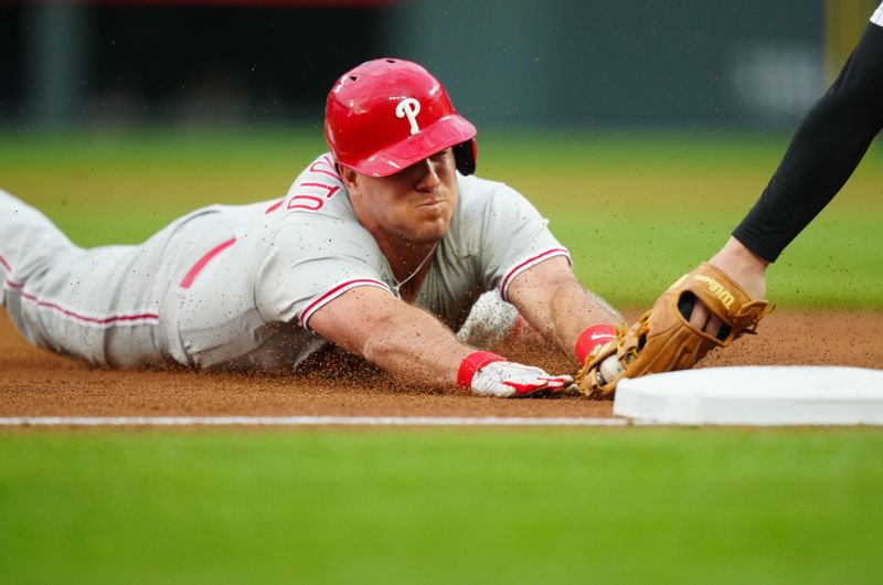 May 12, 2023; Denver, Colorado, USA; Philadelphia Phillies catcher J.T. Realmuto (10) is tagged out by Colorado Rockies third baseman Ryan McMahon (24) in the fifth inning at Coors Field. Mandatory Credit: Ron Chenoy-USA TODAY Sports