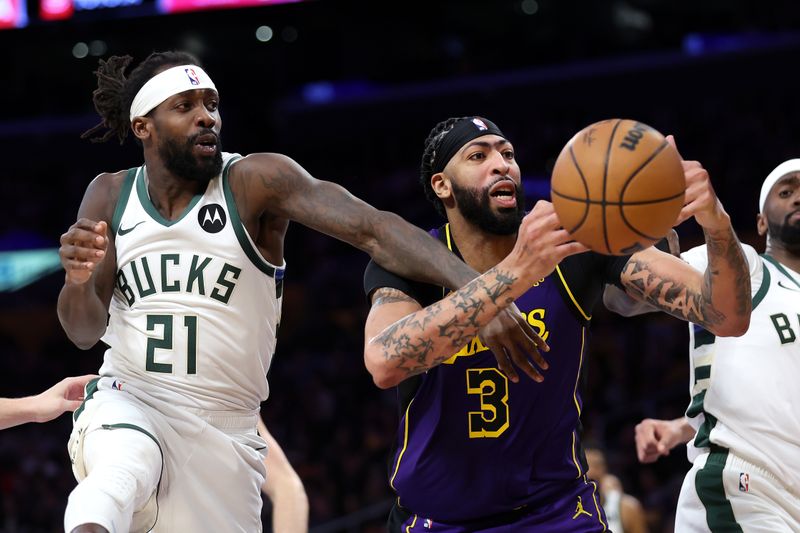 LOS ANGELES, CALIFORNIA - MARCH 08: Anthony Davis #3 of the Los Angeles Lakers and Patrick Beverley #21 of the Milwaukee Bucks battle for a rebound during the second half of a game at Crypto.com Arena on March 08, 2024 in Los Angeles, California. (Photo by Sean M. Haffey/Getty Images)