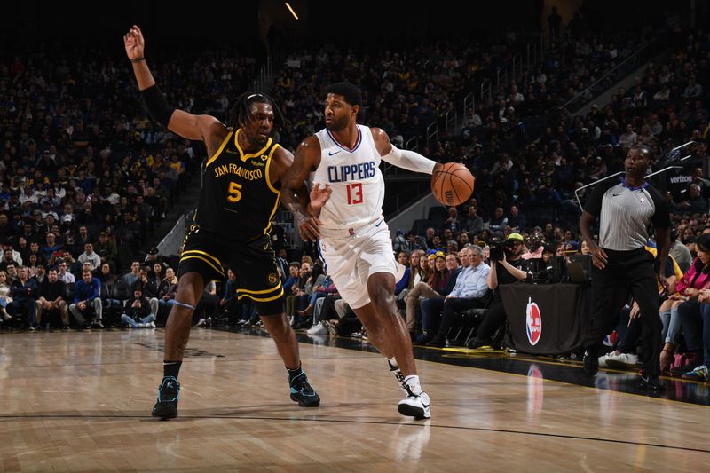 SAN FRANCISCO, CA - FEBRUARY 14: Paul George #13 of the LA Clippers dribbles the ball during the game against the Golden State Warriors on FEBRUARY 14, 2024 at Chase Center in San Francisco, California. NOTE TO USER: User expressly acknowledges and agrees that, by downloading and or using this photograph, user is consenting to the terms and conditions of Getty Images License Agreement. Mandatory Copyright Notice: Copyright 2024 NBAE (Photo by Noah Graham/NBAE via Getty Images)