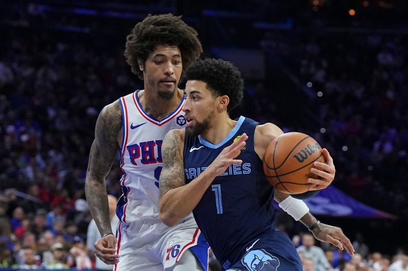 PHILADELPHIA, PENNSYLVANIA - NOVEMBER 2: Scotty Pippen Jr. #1 of the Memphis Grizzlies drives to the basket against Kelly Oubre Jr. #9 of the Philadelphia 76ers in the first half at the Wells Fargo Center on November 2, 2024 in Philadelphia, Pennsylvania. NOTE TO USER: User expressly acknowledges and agrees that, by downloading and/or using this photograph, user is consenting to the terms and conditions of the Getty Images License Agreement. (Photo by Mitchell Leff/Getty Images)