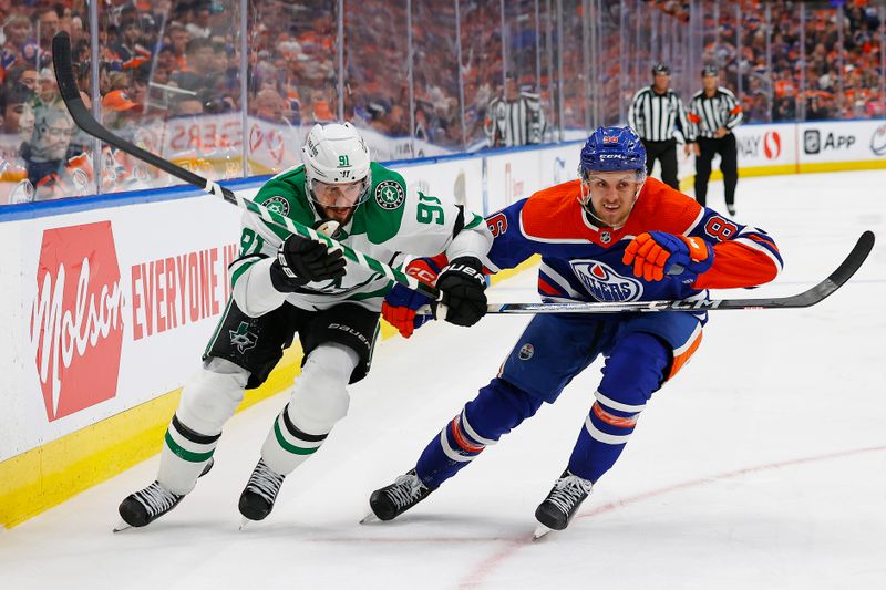 Jun 2, 2024; Edmonton, Alberta, CAN;Dallas Stars forward Tyler Sequin (91) and Edmonton Oilers defensemen Philip Broberg (86) chase a loose puck during the second period in game six of the Western Conference Final of the 2024 Stanley Cup Playoffs at Rogers Place. Mandatory Credit: Perry Nelson-USA TODAY Sports