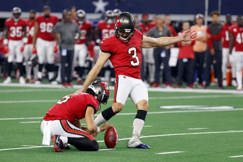 Tampa Bay Buccaneers punter Jake Camarda (5) holds as place kicker Ryan Succop (3) kicks a field goal in the first half of a NFL football game against the Dallas Cowboys in Arlington, Texas, Sunday, Sept. 11, 2022. (AP Photo/Ron Jenkins)