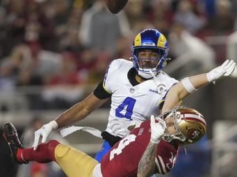 San Francisco 49ers wide receiver Ricky Pearsall, bottom, is unable to catch a pass while defended by Los Angeles Rams cornerback Ahkello Witherspoon during an NFL football game Thursday, Dec. 12, 2024, in Santa Clara, Calif. (AP Photo/Godofredo A. Vásquez)