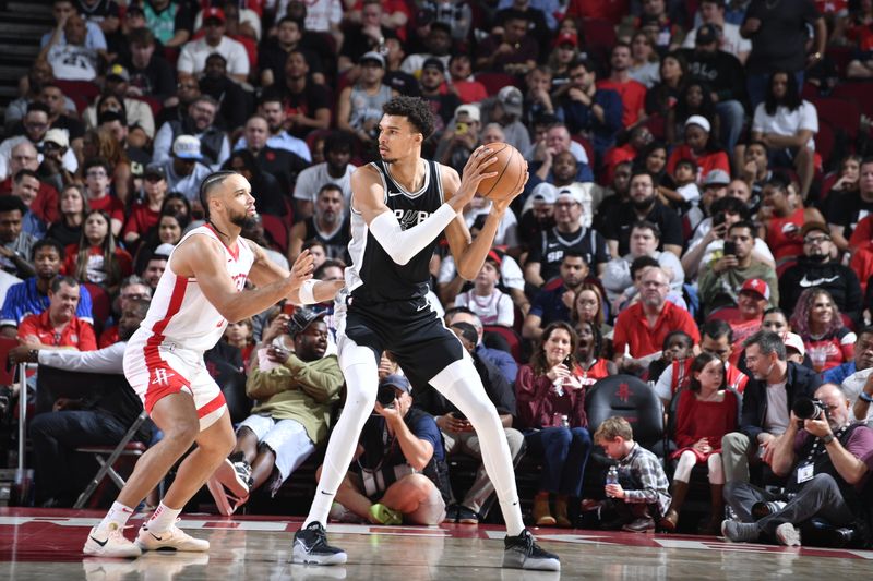 HOUSTON, TX - NOVEMBER 6: Victor Wembanyama #1 of the San Antonio Spurs looks to pass the ball during the game against the Houston Rockets  on November 6, 2024 at the Toyota Center in Houston, Texas. NOTE TO USER: User expressly acknowledges and agrees that, by downloading and or using this photograph, User is consenting to the terms and conditions of the Getty Images License Agreement. Mandatory Copyright Notice: Copyright 2024 NBAE (Photo by Logan Riely/NBAE via Getty Images)