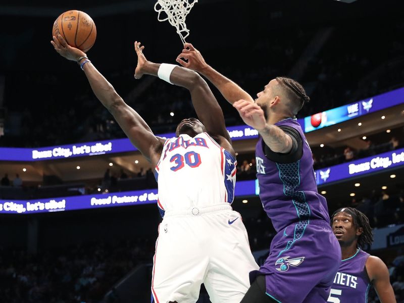 CHARLOTTE, NC - DECEMBER 3: Adem Bona #30 of the Philadelphia 76ers drives to the basket during the game against the Charlotte Hornets during an NBA Emirates Cup game on December 3, 2024 at Spectrum Center in Charlotte, North Carolina. NOTE TO USER: User expressly acknowledges and agrees that, by downloading and or using this photograph, User is consenting to the terms and conditions of the Getty Images License Agreement. Mandatory Copyright Notice: Copyright 2024 NBAE (Photo by Brock Williams-Smith/NBAE via Getty Images)