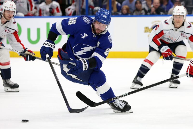 Nov 27, 2024; Tampa, Florida, USA; Tampa Bay Lightning right wing Nikita Kucherov (86) skates after the puck against the Washington Capitals during the first period at Amalie Arena. Mandatory Credit: Kim Klement Neitzel-Imagn Images