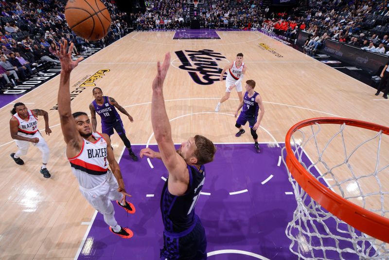 SACRAMENTO, CA - OCTOBER 28: Rayan Rupert #21 of the Portland Trail Blazers drives to the basket during the game against the Sacramento Kings on October 28, 2024 at Golden 1 Center in Sacramento, California. NOTE TO USER: User expressly acknowledges and agrees that, by downloading and or using this Photograph, user is consenting to the terms and conditions of the Getty Images License Agreement. Mandatory Copyright Notice: Copyright 2024 NBAE (Photo by Rocky Widner/NBAE via Getty Images)