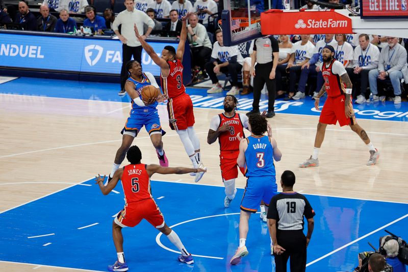 OKLAHOMA CITY, OK - APRIL 24: Jalen Williams #8 of the Oklahoma City Thunder drives to the basket during the game against the New Orleans Pelicans during Round 1 Game 2 of the 2024 NBA Playoffs on April 24, 2024 at Paycom Arena in Oklahoma City, Oklahoma. NOTE TO USER: User expressly acknowledges and agrees that, by downloading and or using this photograph, User is consenting to the terms and conditions of the Getty Images License Agreement. Mandatory Copyright Notice: Copyright 2024 NBAE (Photo by Martin McGrew/NBAE via Getty Images)