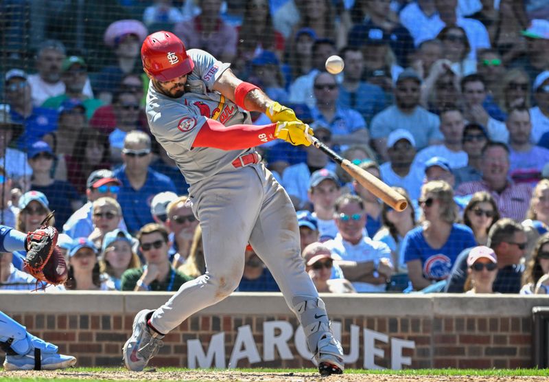 Jun 14, 2024; Chicago, Illinois, USA;  St. Louis Cardinals catcher Ivan Herrera (48)  hits an RBI double against the Chicago Cubs   during the ninth inning at Wrigley Field. Mandatory Credit: Matt Marton-USA TODAY Sports