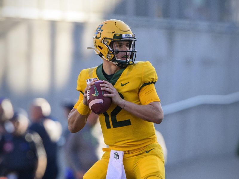 Nov 23, 2019; Waco, TX, USA; Baylor Bears quarterback Charlie Brewer (12) drops back to pass against the Texas Longhorns during the second quarter at McLane Stadium. Mandatory Credit: Jerome Miron-USA TODAY Sports