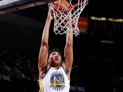 PORTLAND, OR - DECEMBER 17: Trayce Jackson-Davis #32 of the Golden State Warriors  drives to the basket during the game against the Portland Trail Blazers on December 17, 2023 at the Moda Center Arena in Portland, Oregon. NOTE TO USER: User expressly acknowledges and agrees that, by downloading and or using this photograph, user is consenting to the terms and conditions of the Getty Images License Agreement. Mandatory Copyright Notice: Copyright 2023 NBAE (Photo by Cameron Browne/NBAE via Getty Images)