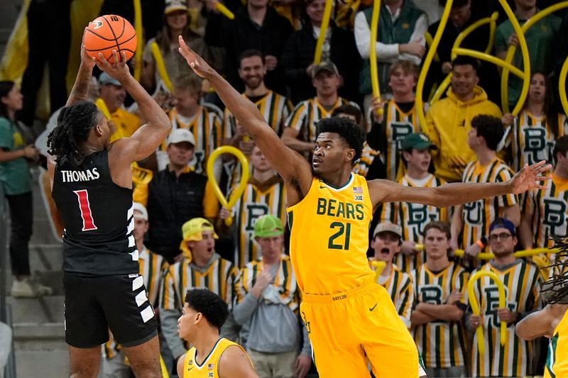 Jan 13, 2024; Waco, Texas, USA; Cincinnati Bearcats guard Day Day Thomas (1) shoots over  Baylor Bears center Yves Missi (21) during the second half at Paul and Alejandra Foster Pavilion. Mandatory Credit: Raymond Carlin III-USA TODAY Sports