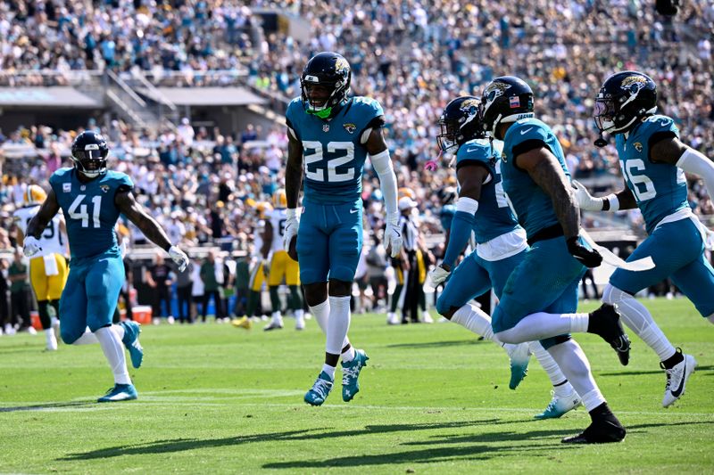 Jacksonville Jaguars' Jarrian Jones celebrates his interception during the first half of an NFL football game against the Green Bay Packers Sunday, Oct. 27, 2024, in Jacksonville, Fla. (AP Photo/Phelan M. Ebenhack)