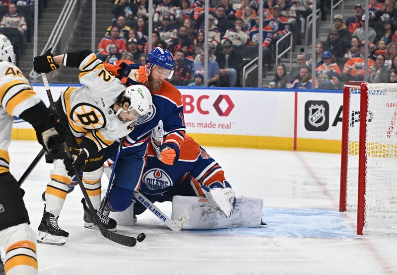 Dec 31, 2025; Edmonton, Alberta, CAN;  Boston Bruins center Marat Khusnutdinov (92) plays the puck defended by Edmonton Oilers goalie Connor Ingram (39) and defenseman Mattias Ekholm (14) during the second period at Rogers Place. Mandatory Credit: Walter Tychnowicz-Imagn Images