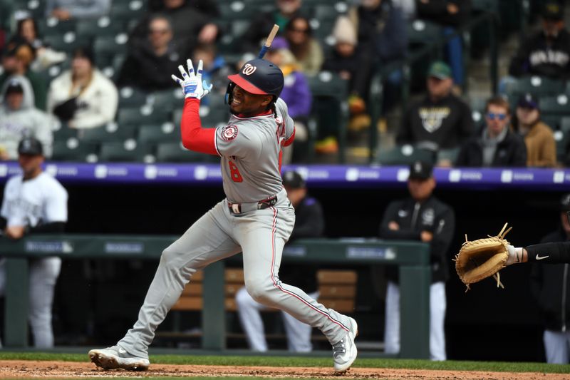 Apr 19, 2025; Denver, Colorado, USA; Washington Nationals third base Jose Tena (8) hits a broken bat RBI double during the seventh inning against the Colorado Rockies at Coors Field. Mandatory Credit: Christopher Hanewinckel-Imagn Images