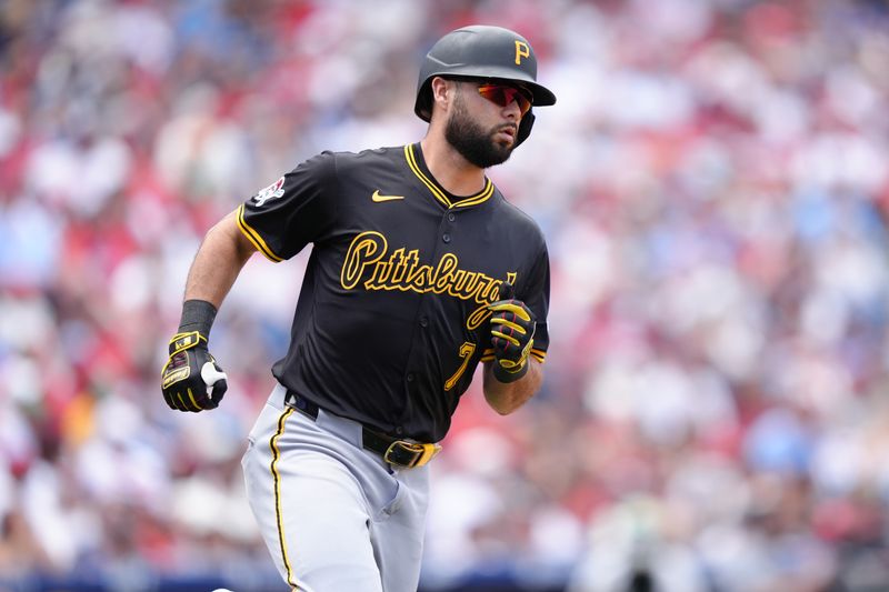 May 18, 2025; Philadelphia, Pennsylvania, USA; Pittsburgh Pirates infielder Isiah Kiner-Falefa (7) runs to first after hitting a single against the Philadelphia Phillies in the fifth inning at Citizens Bank Park. Mandatory Credit: Kyle Ross-Imagn Images