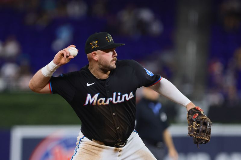 May 17, 2024; Miami, Florida, USA; Miami Marlins third baseman Jake Burger (36) throws to first base against the New York Mets during the sixth inning at loanDepot Park. Mandatory Credit: Sam Navarro-USA TODAY Sports