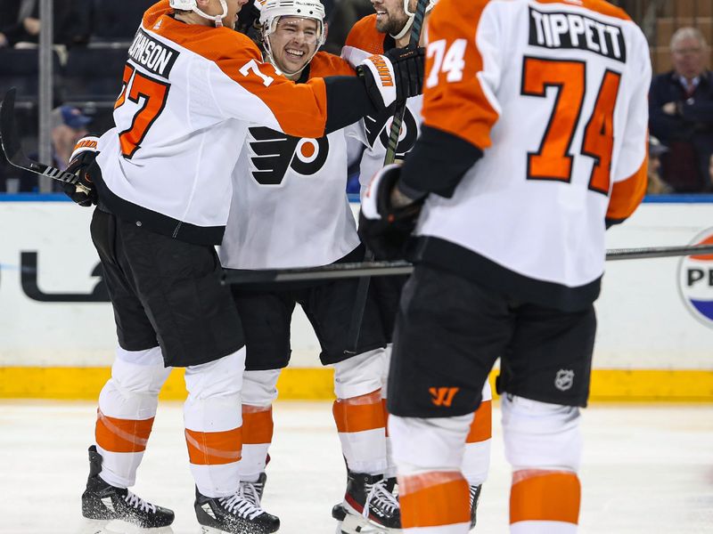 Apr 11, 2024; New York, New York, USA; Philadelphia Flyers right wing Bobby Brink (10) celebrates his goal against the New York Rangers with Philadelphia Flyers defenseman Erik Johnson (77) during the second period at Madison Square Garden. Mandatory Credit: Danny Wild-USA TODAY Sports