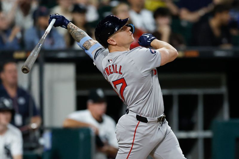 Jun 6, 2024; Chicago, Illinois, USA; Boston Red Sox outfielder Tyler O'Neill (17) hits a single against the Chicago White Sox during the sixth inning at Guaranteed Rate Field. Mandatory Credit: Kamil Krzaczynski-USA TODAY Sports