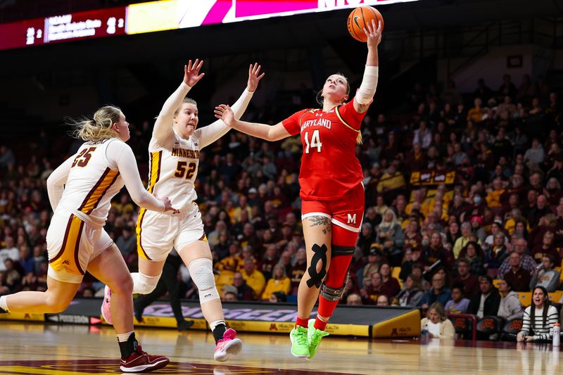 Jan 3, 2024; Minneapolis, Minnesota, USA; Maryland Terrapins forward Allie Kubek (14) shoots as Minnesota Golden Gophers center Sophie Hart (52) and guard Grace Grocholski (25) defend during the second half at Williams Arena. Mandatory Credit: Matt Krohn-USA TODAY Sports