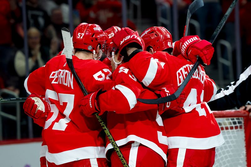 Nov 30, 2023; Detroit, Michigan, USA; Detroit Red Wings left wing J.T. Compher (37) receives congratulations from teammates after scoring in the second period against the Chicago Blackhawks at Little Caesars Arena. Mandatory Credit: Rick Osentoski-USA TODAY Sports