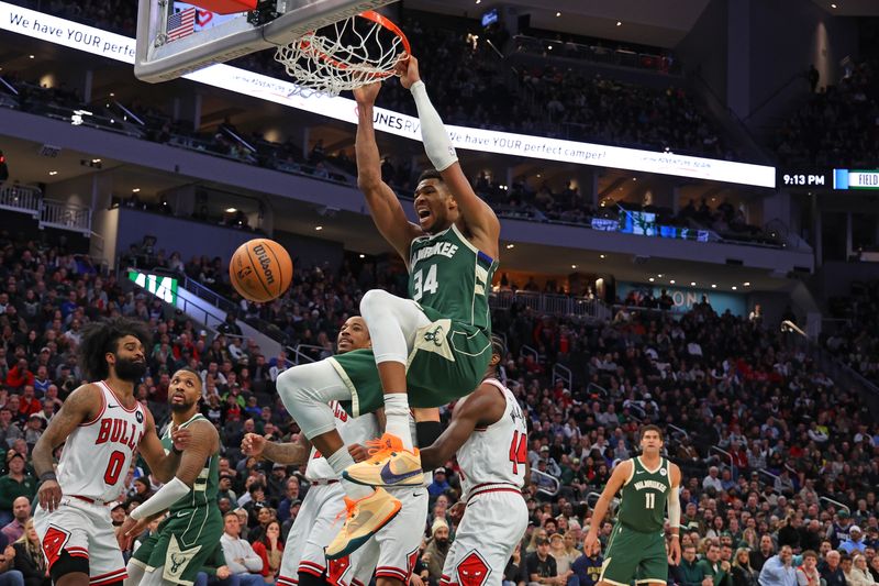 MILWAUKEE, WISCONSIN - DECEMBER 11: Giannis Antetokounmpo #34 of the Milwaukee Bucks dunks against the Chicago Bulls during the second half of a game at Fiserv Forum on December 11, 2023 in Milwaukee, Wisconsin. NOTE TO USER: User expressly acknowledges and agrees that, by downloading and or using this photograph, User is consenting to the terms and conditions of the Getty Images License Agreement. (Photo by Stacy Revere/Getty Images)