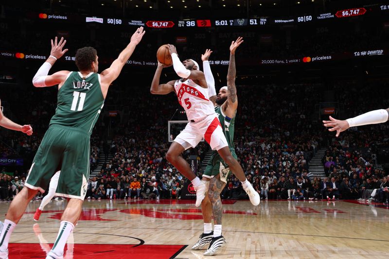 TORONTO, CANADA - JANUARY 6: Immanuel Quickley #5 of the Toronto Raptors drives to the basket during the game against the Milwaukee Bucks on January 6, 2025 at the Scotiabank Arena in Toronto, Ontario, Canada.  NOTE TO USER: User expressly acknowledges and agrees that, by downloading and or using this Photograph, user is consenting to the terms and conditions of the Getty Images License Agreement.  Mandatory Copyright Notice: Copyright 2025 NBAE (Photo by Vaughn Ridley/NBAE via Getty Images)