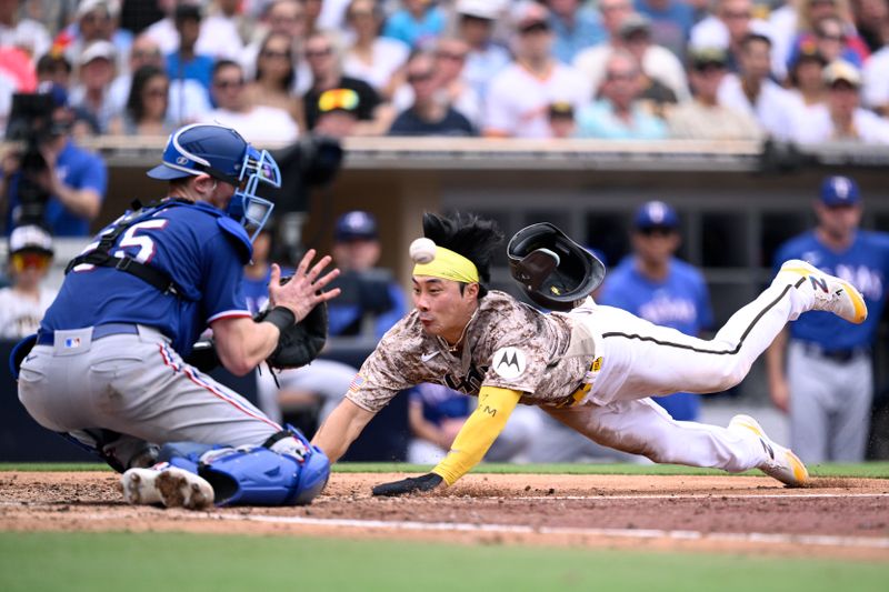 Jul 30, 2023; San Diego, California, USA; San Diego Padres second baseman Ha-seong Kim (7) scores a run ahead of the throw to Texas Rangers catcher Sam Huff (55) during the third inning at Petco Park. Mandatory Credit: Orlando Ramirez-USA TODAY Sports