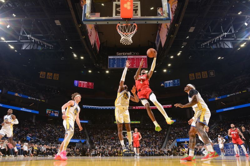 SAN FRANCISCO, CA - DECEMBER 5: Jalen Green #4 of the Houston Rockets drives to the basket during the game against the Golden State Warriors on December 5, 2024 at Chase Center in San Francisco, California. NOTE TO USER: User expressly acknowledges and agrees that, by downloading and or using this photograph, user is consenting to the terms and conditions of Getty Images License Agreement. Mandatory Copyright Notice: Copyright 2024 NBAE (Photo by Noah Graham/NBAE via Getty Images)