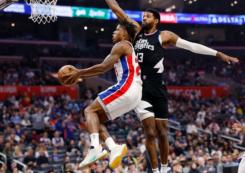 LOS ANGELES, CALIFORNIA - FEBRUARY 10: Marcus Sasser #25 of the Detroit Pistons scores a basket against Paul George #13 of the Los Angeles Clippers during the first half at Crypto.com Arena on February 10, 2024 in Los Angeles, California. NOTE TO USER: User expressly acknowledges and agrees that, by downloading and or using this photograph, User is consenting to the terms and conditions of the Getty Images License Agreement. (Photo by Kevork Djansezian/Getty Images)