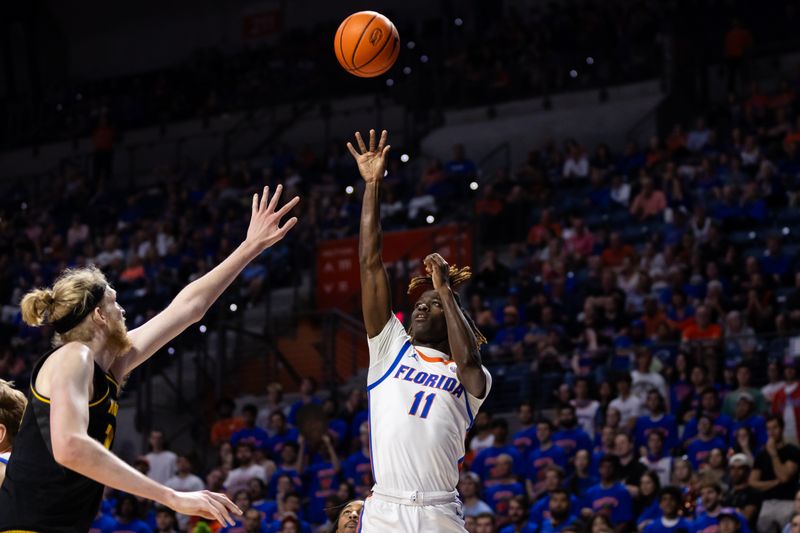 Feb 28, 2024; Gainesville, Florida, USA; Florida Gators guard Denzel Aberdeen (11) shoots over Missouri Tigers center Connor Vanover (75) during the second half at Exactech Arena at the Stephen C. O'Connell Center. Mandatory Credit: Matt Pendleton-USA TODAY Sports