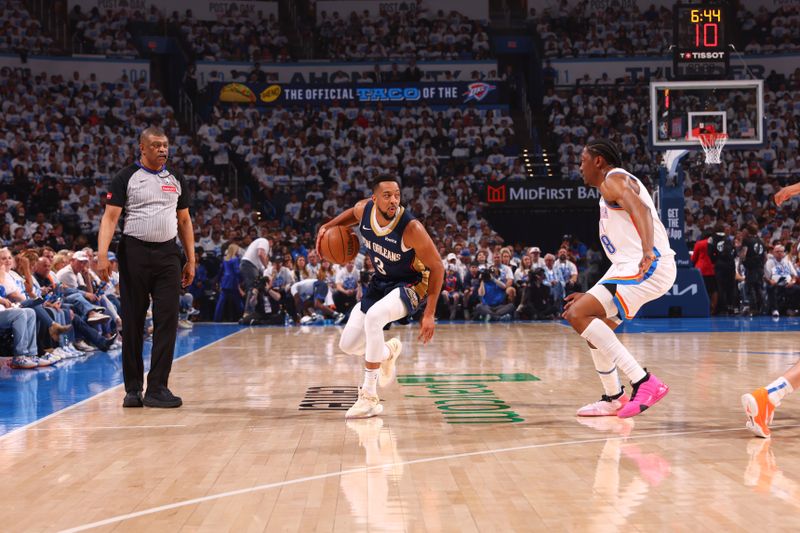 OKLAHOMA CITY, OK - APRIL 21:  CJ McCollum #3 of the New Orleans Pelicans handles the ball during the game against the Oklahoma City Thunder during Round 1 Game 1 of the 2024 NBA Playoffs on April 21, 2024 at Paycom Arena in Oklahoma City, Oklahoma. NOTE TO USER: User expressly acknowledges and agrees that, by downloading and or using this photograph, User is consenting to the terms and conditions of the Getty Images License Agreement. Mandatory Copyright Notice: Copyright 2024 NBAE (Photo by Zach Beeker/NBAE via Getty Images)