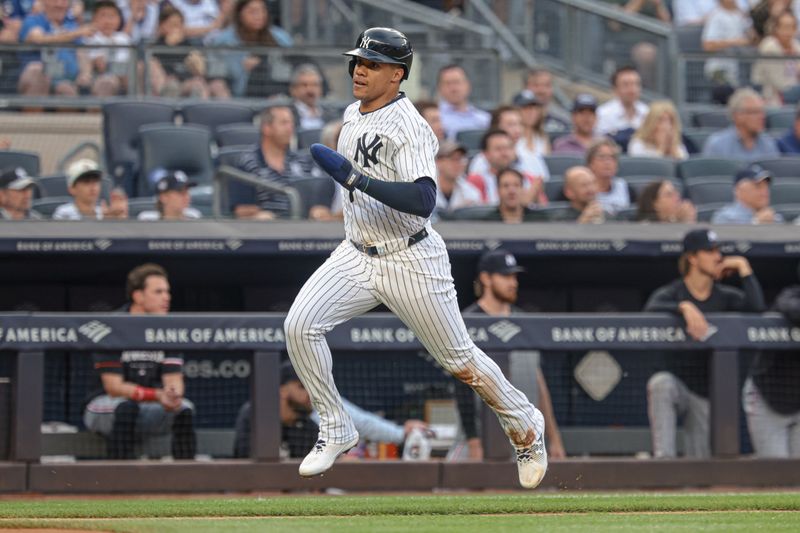 Jun 5, 2024; Bronx, New York, USA; New York Yankees right fielder Juan Soto (22) scores a run on a single by designated hitter Giancarlo Stanton (27) during the first inning against the Minnesota Twins at Yankee Stadium. Mandatory Credit: Vincent Carchietta-USA TODAY Sports