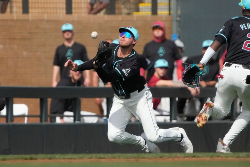 Feb 27, 2024; Salt River Pima-Maricopa, Arizona, USA; Arizona Diamondbacks right fielder Jake McCarthy (31) makes the running catch against the Texas Rangers during the second inning at Salt River Fields at Talking Stick. Mandatory Credit: Rick Scuteri-USA TODAY Sports