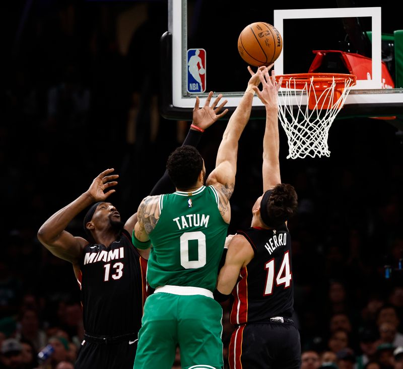 BOSTON, MA - APRIL 24: Jayson Tatum #0 of the Boston Celtics goes to the basket between Bam Adebayo #13 and Tyler Herro #14 of the Miami Heat during the second quarter of game two of the Eastern Conference First Round Playoffs at TD Garden on April 24, 2024 in Boston, Massachusetts. NOTE TO USER: User expressly acknowledges and agrees that, by downloading and/or using this Photograph, user is consenting to the terms and conditions of the Getty Images License Agreement. (Photo By Winslow Townson/Getty Images)