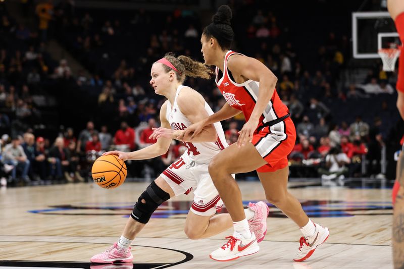 Mar 4, 2023; Minneapolis, MINN, USA; Indiana Hoosiers guard Grace Berger (34) dribbles while Ohio State Buckeyes forward Taylor Thierry (2) defends during the second half at Target Center. Mandatory Credit: Matt Krohn-USA TODAY Sports