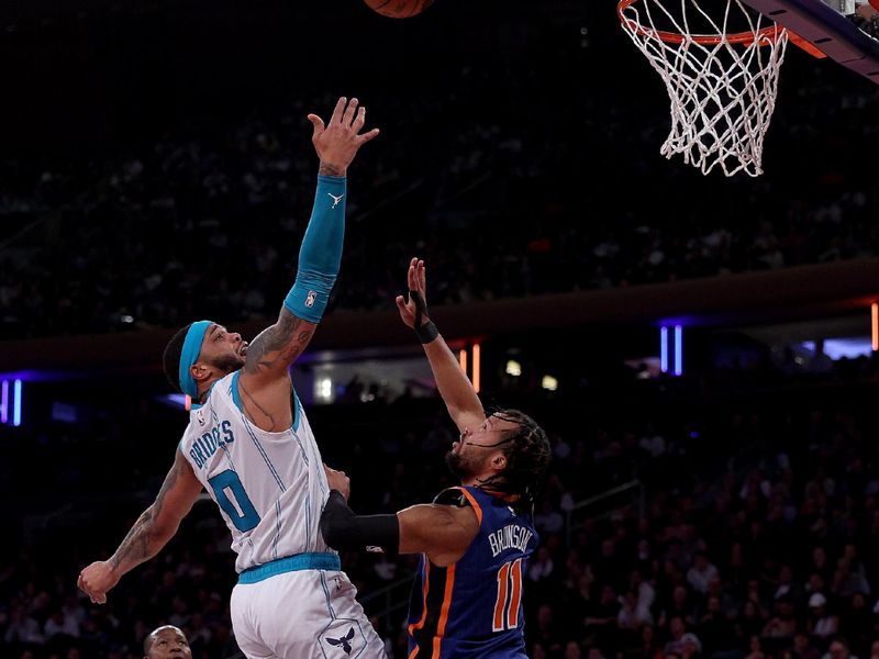 NEW YORK, NEW YORK - NOVEMBER 28:  Miles Bridges #0 of the Charlotte Hornets takes a shot as Jalen Brunson #11 of the New York Knicks defends during the second half of an NBA In-Season Tournament game at Madison Square Garden on November 28, 2023 in New York City. The New York Knicks defeated the Charlotte Hornets 115-91.NOTE TO USER: User expressly acknowledges and agrees that, by downloading and or using this photograph, User is consenting to the terms and conditions of the Getty Images License Agreement. (Photo by Elsa/Getty Images)