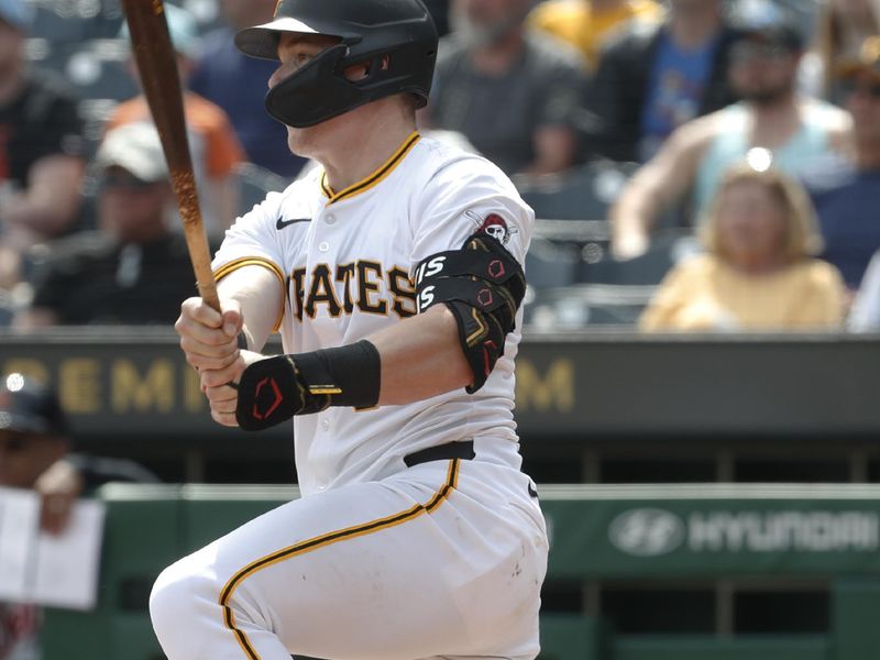 Apr 9, 2024; Pittsburgh, Pennsylvania, USA;  Pittsburgh Pirates catcher Henry Davis (32) hits a single against the Detroit Tigers during the ninth inning at PNC Park. Detroit won 5-3. Mandatory Credit: Charles LeClaire-USA TODAY Sports