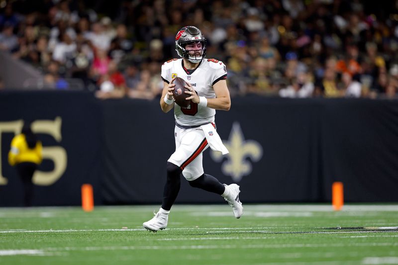 Tampa Bay Buccaneers quarterback Baker Mayfield (6) looks to pass during an NFL football game against the New Orleans Saints, Sunday, Oct. 13, 2024, in New Orleans. (AP Photo/Tyler Kaufman)