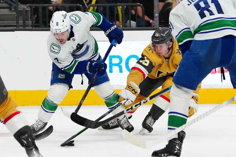 Apr 2, 2024; Las Vegas, Nevada, USA; Vegas Golden Knights left wing Pavel Dorofeyev (16) steals the puck from Vancouver Canucks right wing Conor Garland (8) during the second period at T-Mobile Arena. Mandatory Credit: Stephen R. Sylvanie-USA TODAY Sports