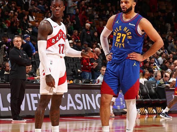 TORONTO, CANADA - DECEMBER 20: Dennis Schroder #17 of the Toronto Raptors and Jamal Murray #27 of the Denver Nuggets look on during the game on December 20, 2023 at the Scotiabank Arena in Toronto, Ontario, Canada.  NOTE TO USER: User expressly acknowledges and agrees that, by downloading and or using this Photograph, user is consenting to the terms and conditions of the Getty Images License Agreement.  Mandatory Copyright Notice: Copyright 2023 NBAE (Photo by Vaughn Ridley/NBAE via Getty Images)