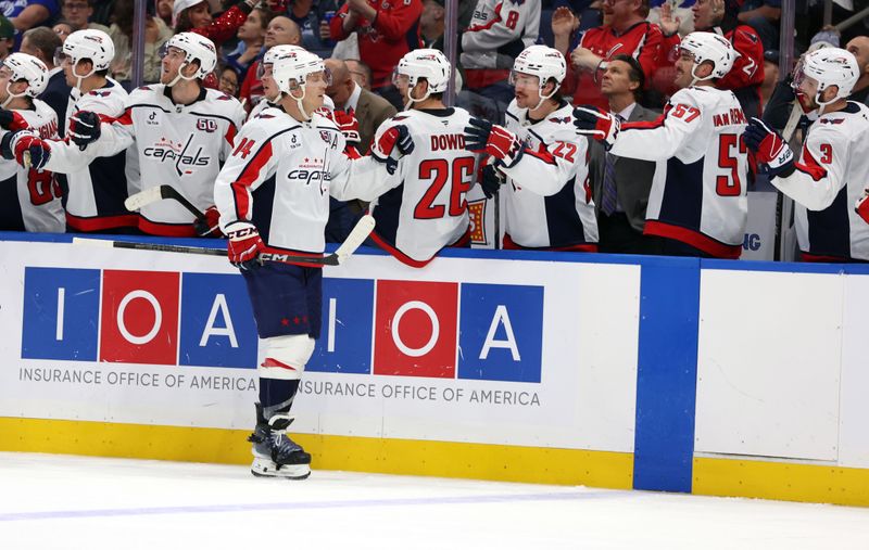 Nov 27, 2024; Tampa, Florida, USA; Washington Capitals defenseman John Carlson (74) is congratulated after he scored a goal against the Tampa Bay Lightning during the third period at Amalie Arena. Mandatory Credit: Kim Klement Neitzel-Imagn Images