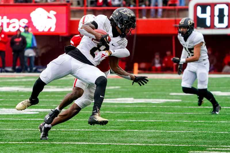 Oct 28, 2023; Lincoln, Nebraska, USA; Purdue Boilermakers wide receiver TJ Sheffield (8) catches a pass against Nebraska Cornhuskers defensive back Quinton Newsome (6) during the second quarter at Memorial Stadium. Mandatory Credit: Dylan Widger-USA TODAY Sports