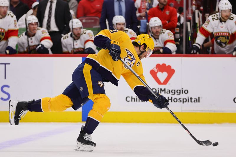 Mar 21, 2024; Sunrise, Florida, USA; Nashville Predators defenseman Roman Josi (59) shoots the puck against the Florida Panthers during the first period at Amerant Bank Arena. Mandatory Credit: Sam Navarro-USA TODAY Sports