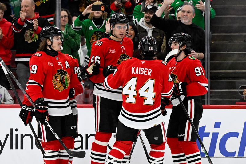 Mar 17, 2026; Chicago, Illinois, USA;  Chicago Blackhawks defenseman Louis Crevier (46) celebrates with teammates after scoring a goal against the Minnesota Wild during the first period at United Center. Mandatory Credit: Matt Marton-Imagn Images