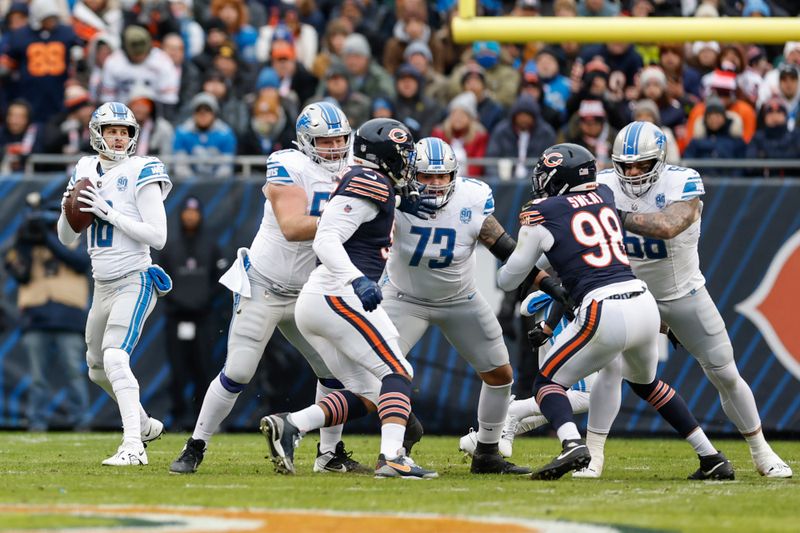 Detroit Lions quarterback Jared Goff (16) looks to pass the ball during the first half of an NFL football game against the Chicago Bears, Sunday, Dec. 10, 2023, in Chicago. (AP Photo/Kamil Krzaczynski)