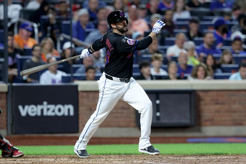 Sep 6, 2024; New York City, New York, USA; New York Mets designated hitter J.D. Martinez (28) follows through on an RBI single against the Cincinnati Reds during the sixth inning at Citi Field. Mandatory Credit: Brad Penner-Imagn Images