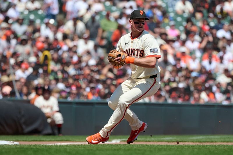 May 4, 2025; San Francisco, California, USA; San Francisco Giants third baseman Matt Chapman (26) prepares to throw the ball to first base against the Colorado Rockies during the fifth inning at Oracle Park. Mandatory Credit: Robert Edwards-Imagn Images