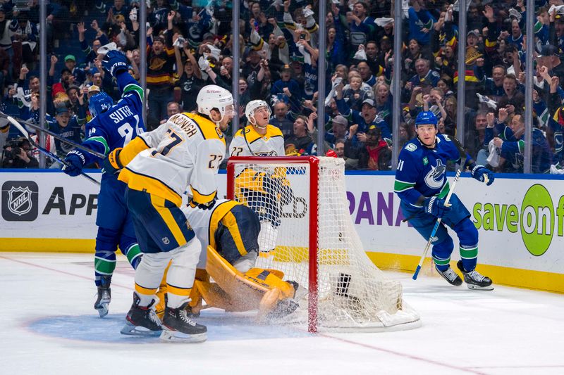 Apr 30, 2024; Vancouver, British Columbia, CAN; Vancouver Canucks forward Pius Suter (24) and Nashville Predators defenseman Ryan McDonagh (27) and defenseman Tyson Barrie (22) react as Vancouver Canucks defenseman Nikita Zadorov (91) celebrates his goal during the third period in game five of the first round of the 2024 Stanley Cup Playoffs at Rogers Arena. Mandatory Credit: Bob Frid-USA TODAY Sports