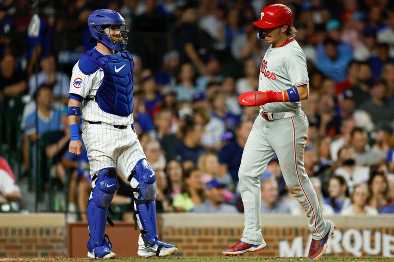 Jul 2, 2024; Chicago, Illinois, USA; Philadelphia Phillies second baseman Bryson Stott (5) scores against the Chicago Cubs during the seventh inning at Wrigley Field. Mandatory Credit: Kamil Krzaczynski-USA TODAY Sports